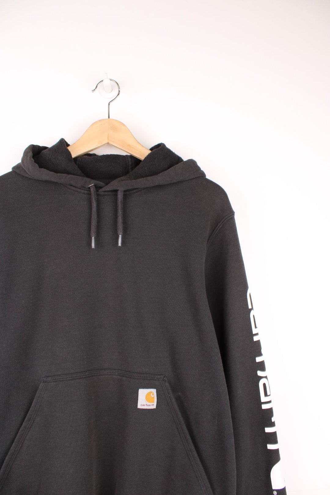 Carhartt 'Original Fit' all black hoodie, features spell-out details down the sleeve and embroidered logo on the pocket