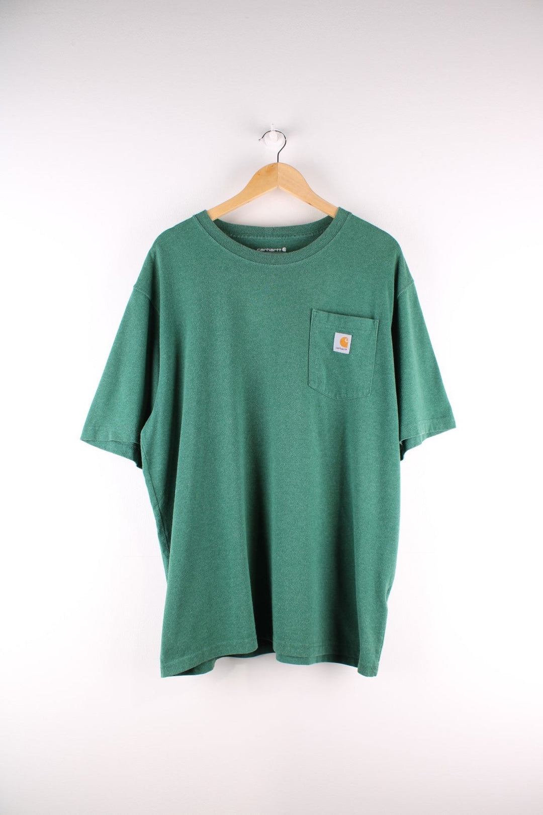 Carhartt T-Shirt in a green colourway with a patch pocket and a logo stitched onto the front.