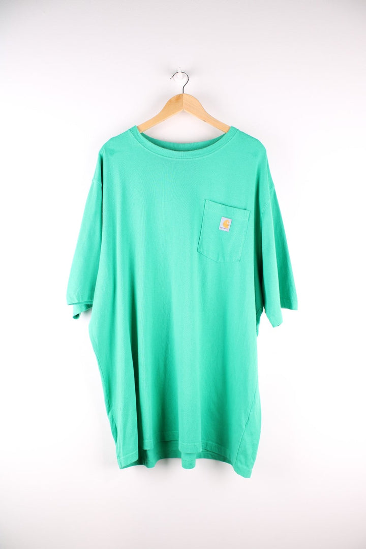  Carhartt T-Shirt in a green colourway with a patch pocket and logo stitched onto the front.