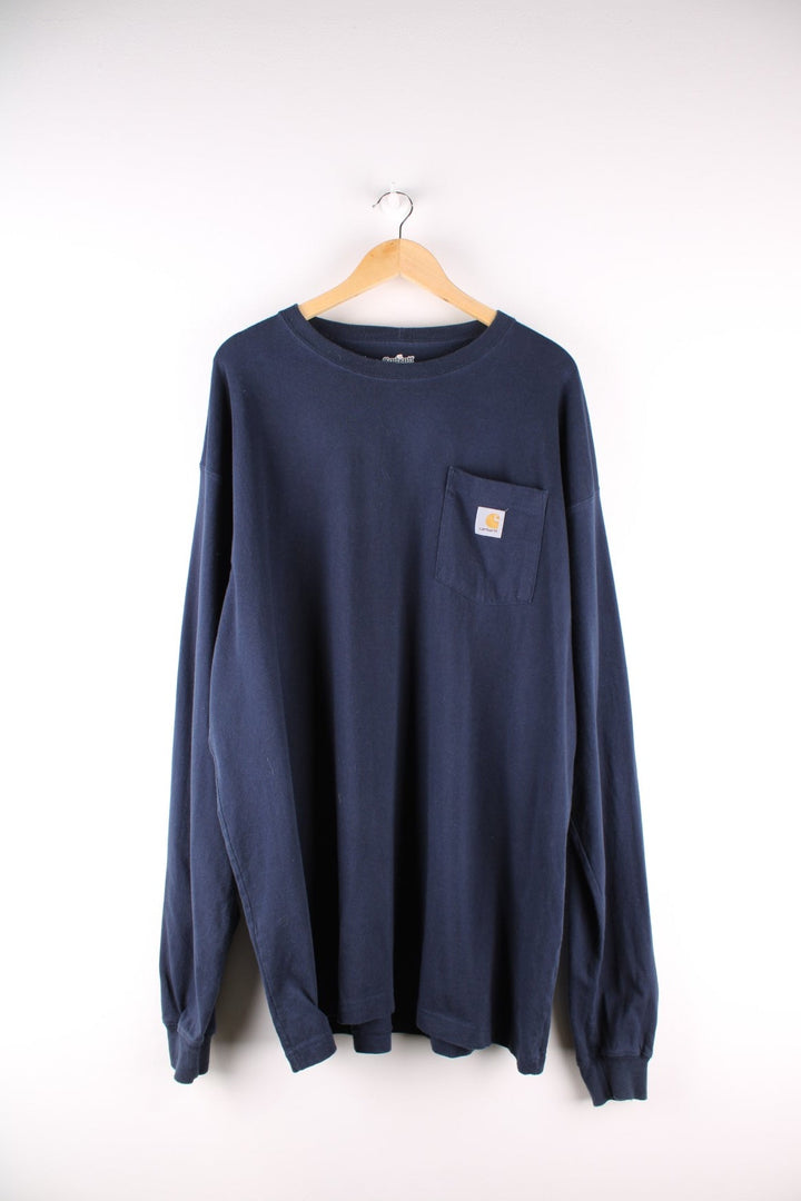 Carhartt longsleeve T-Shirt in a navy blue colourway with a patch pocket and logo stitched onto the front.