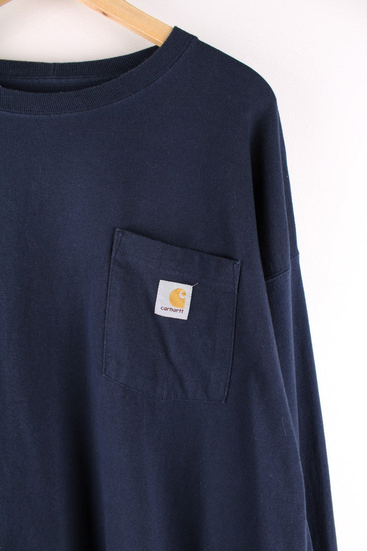 Carhartt longsleeve T-Shirt in a navy blue colourway with a patch pocket and logo stitched onto the front.