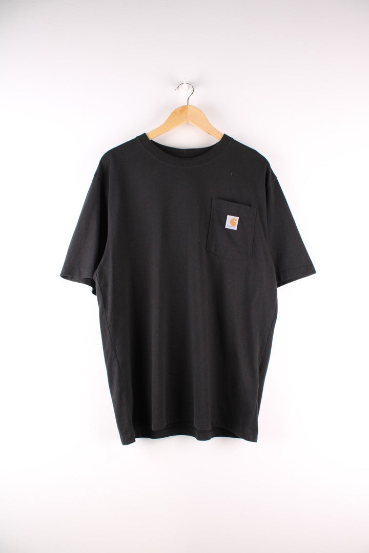 Carhartt T-Shirt in a black colourway with a patch pocket and logo stitched onto the front.