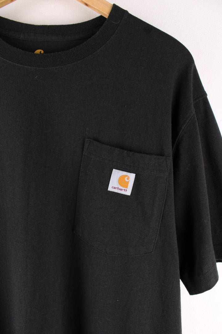 Carhartt T-Shirt in a black colourway with a patch pocket and logo embroidered on the front.