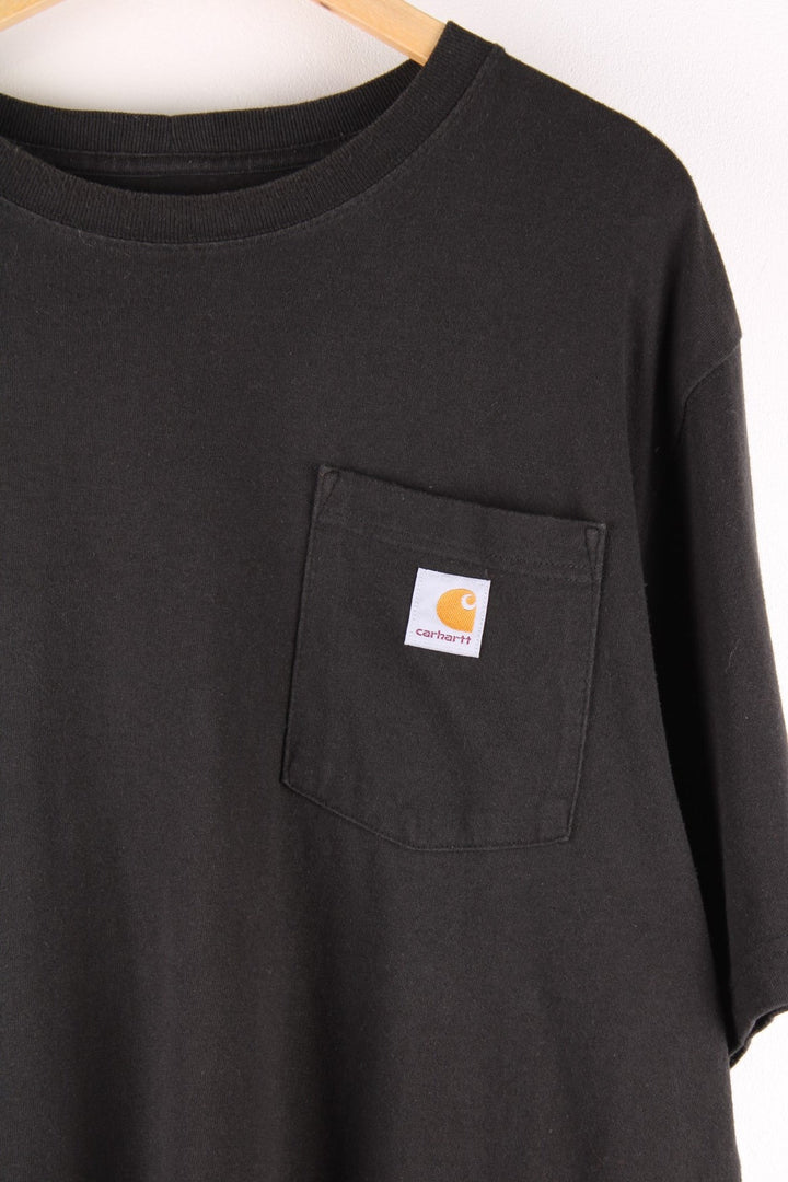 Carhartt T-Shirt in a black colourway with a patch pocket and logo stitched onto the front. 