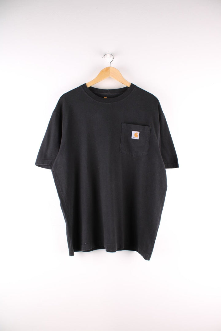 Carhartt T-Shirt in a black colourway with a patch pocket and logo stitched onto the front.