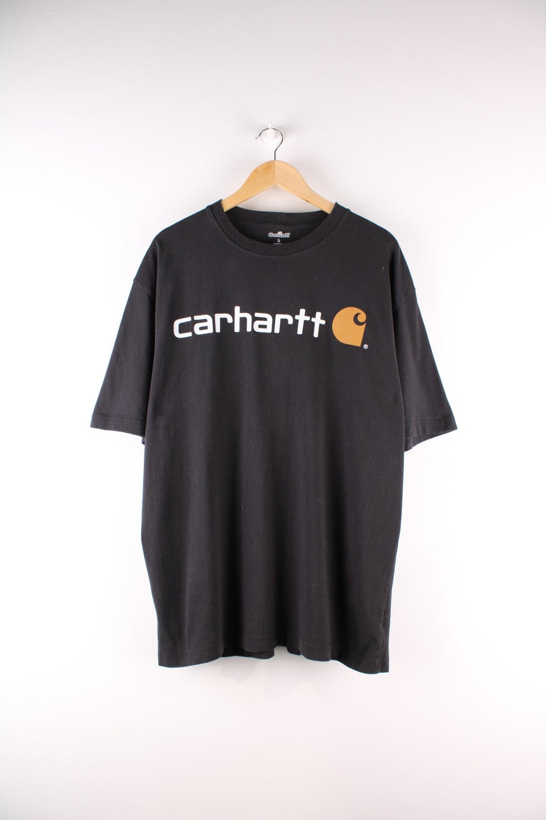 Carhartt T-Shirt in a black colourway with a large logo printed on the front.