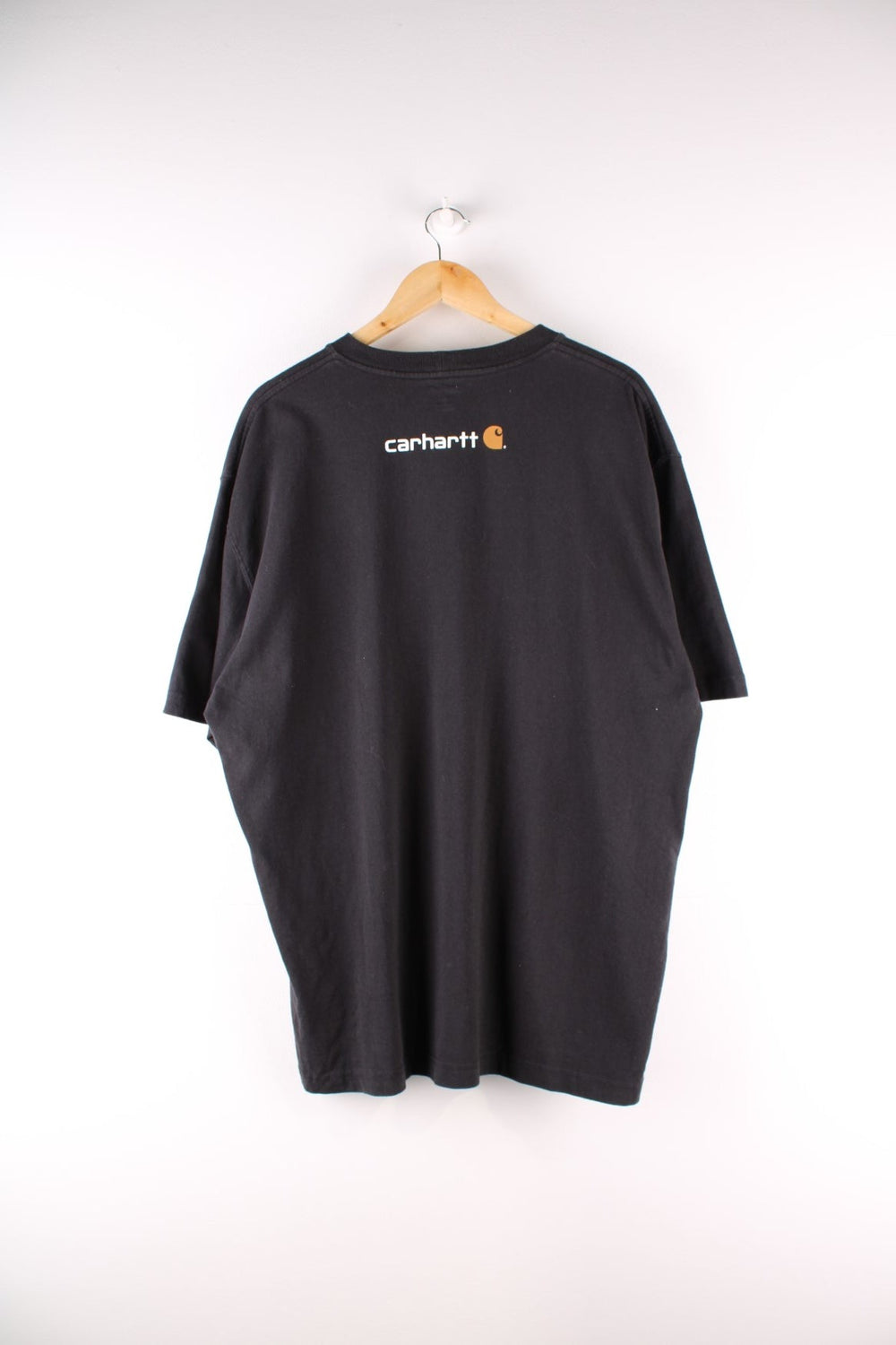 Carhartt T-Shirt in a black colourway with a large logo printed on the front.