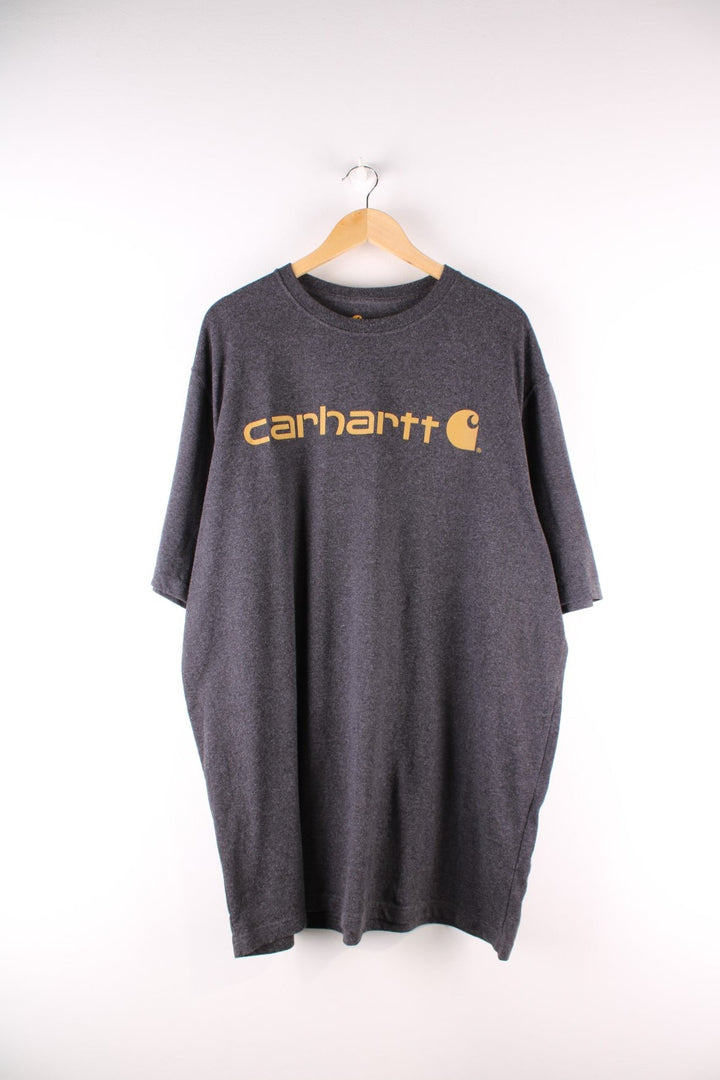 Carhartt T-Shirt in a dark grey colourway with a large orange logo printed on the front.