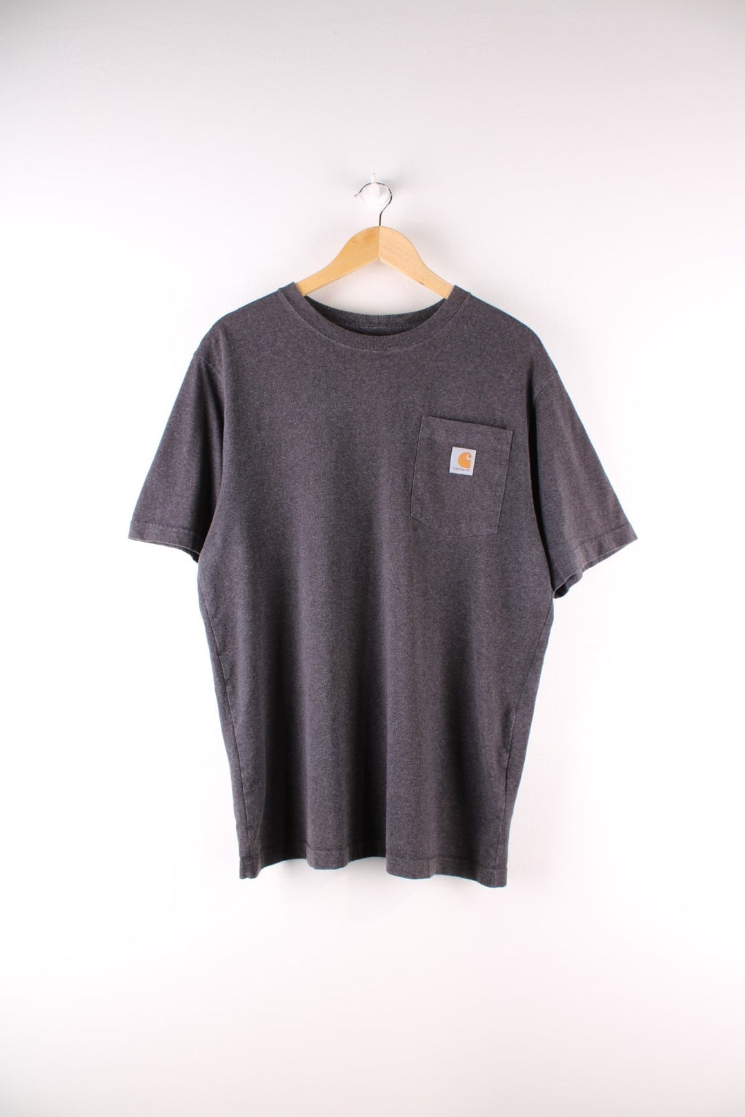 Carhartt T-Shirt in a dark grey colourway with a patch pocket and logo stitched onto the front.