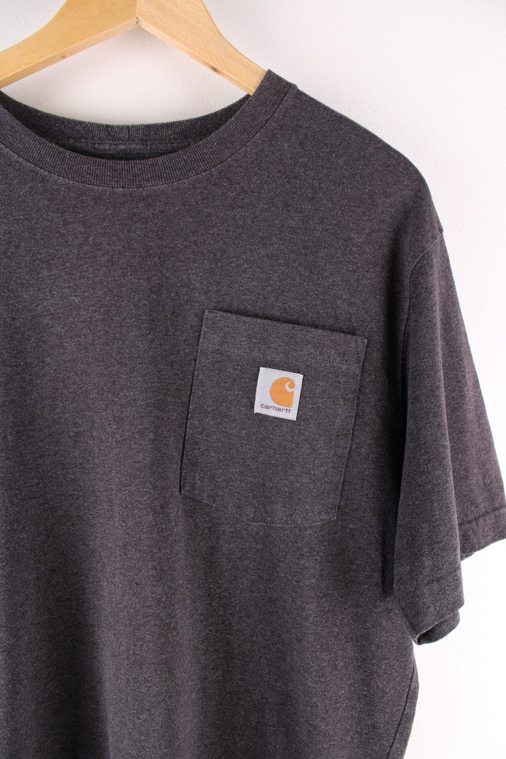 Carhartt T-Shirt in a dark grey colourway with a patch pocket and logo stitched onto the front.