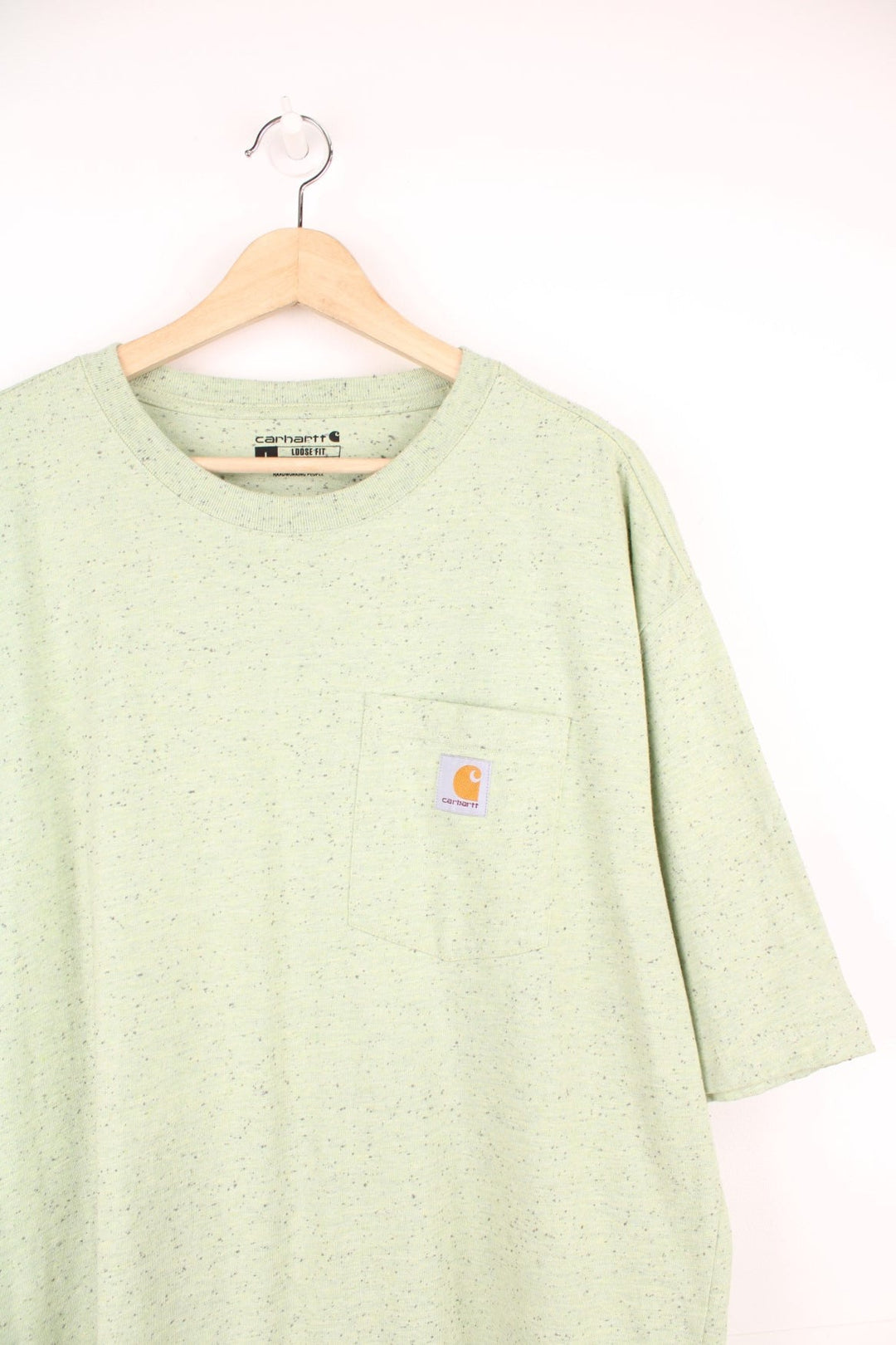 Green Carhartt Loose Fit T-Shirt featuring a chest pocket and embroidered logo.