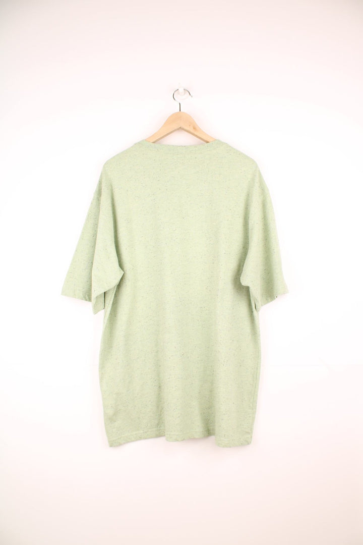 Green Carhartt Loose Fit T-Shirt featuring a chest pocket and embroidered logo.