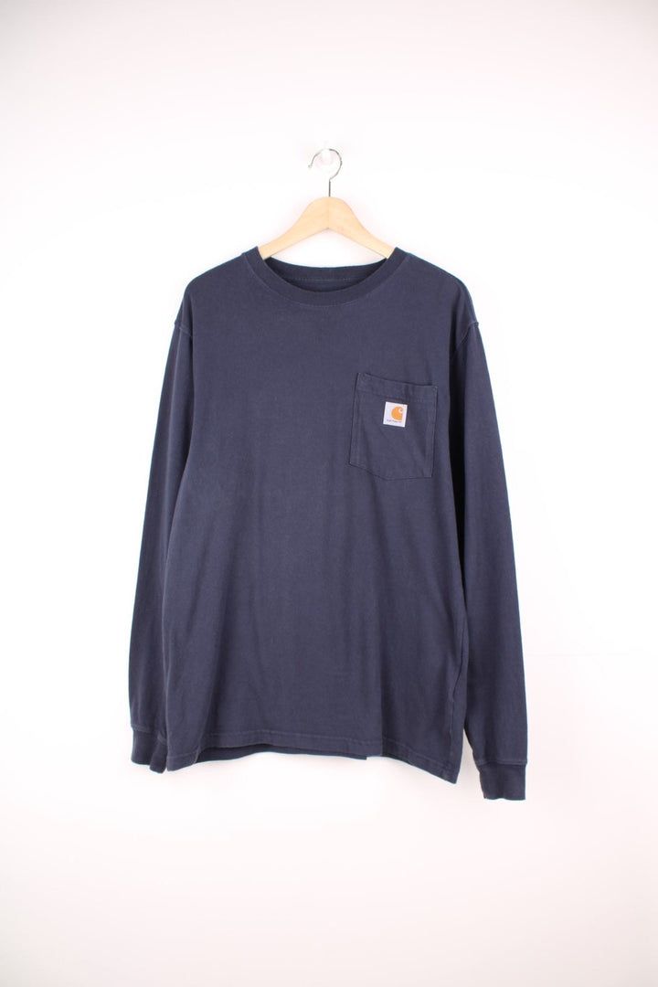 Navy blue Carhartt Loose Fit long sleeved T-Shirt with chest pocket and embroidered logo.