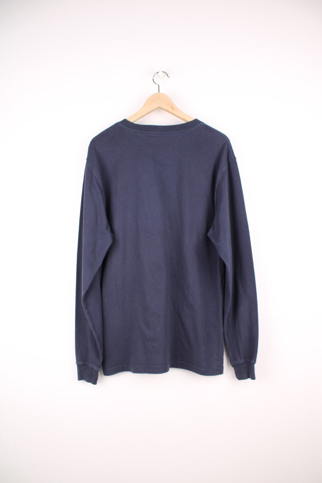 Navy blue Carhartt Loose Fit long sleeved T-Shirt with chest pocket and embroidered logo.