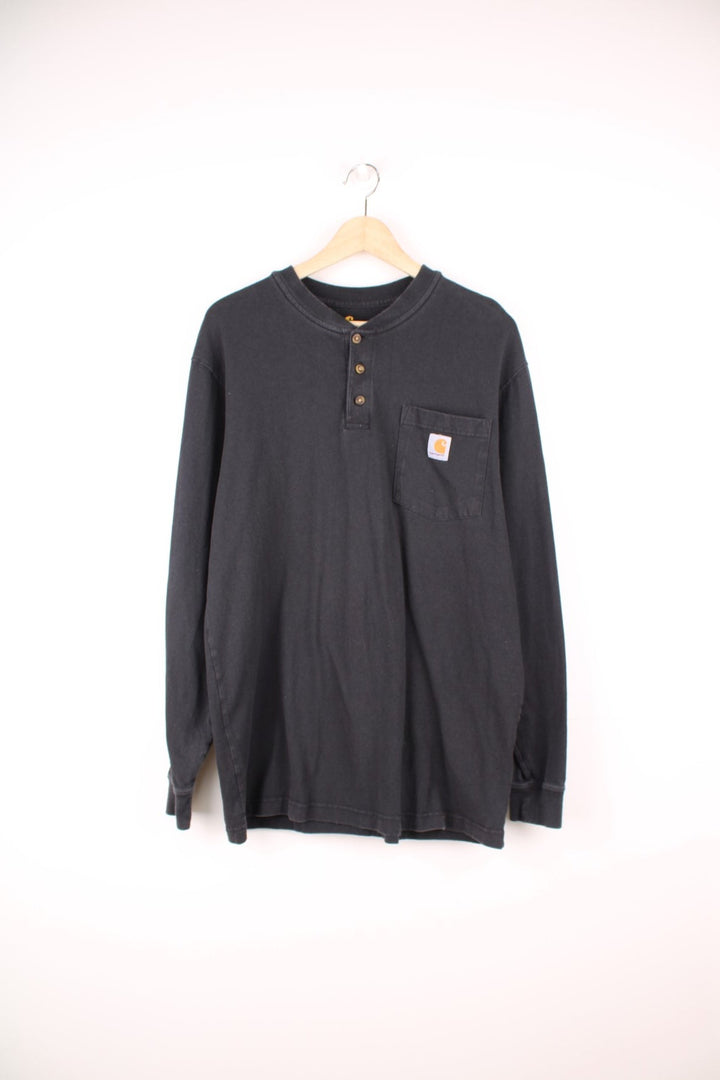 Carhartt Original Fit, long sleeved top with three buttons, chest pocket and embroidered logo.