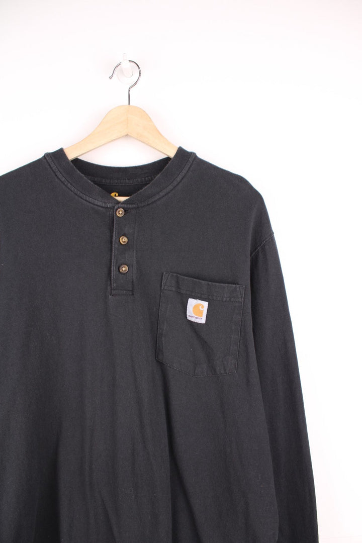 Carhartt Original Fit, long sleeved top with three buttons, chest pocket and embroidered logo.