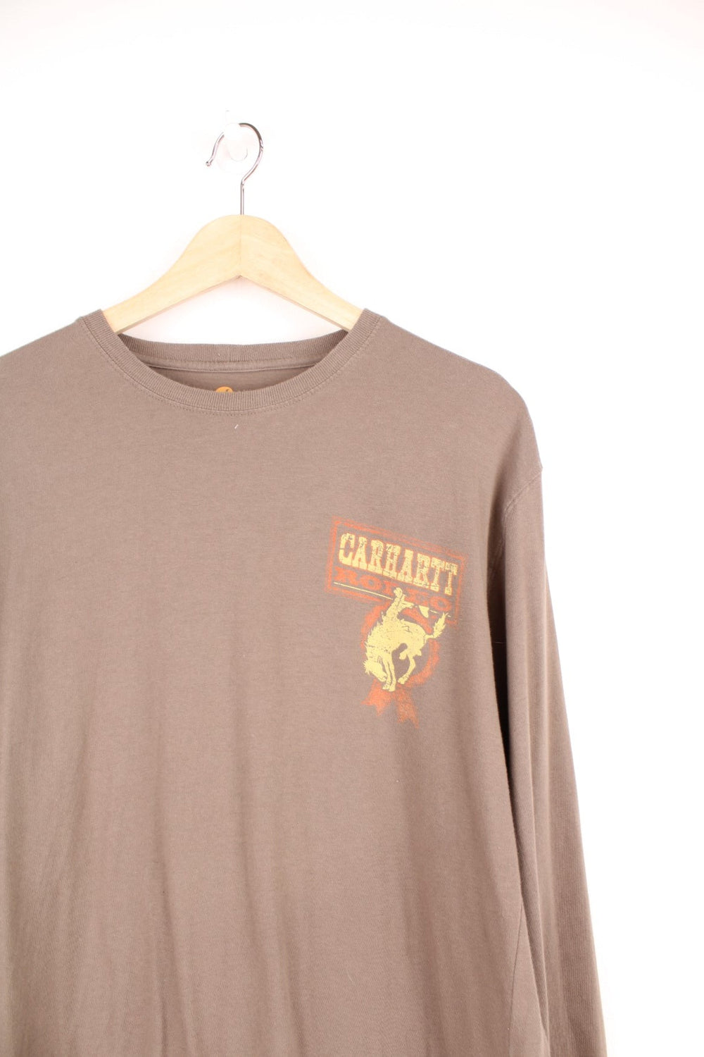 Carhartt Rodeo long sleeved top in brown, with graphic print on the chest and the back.