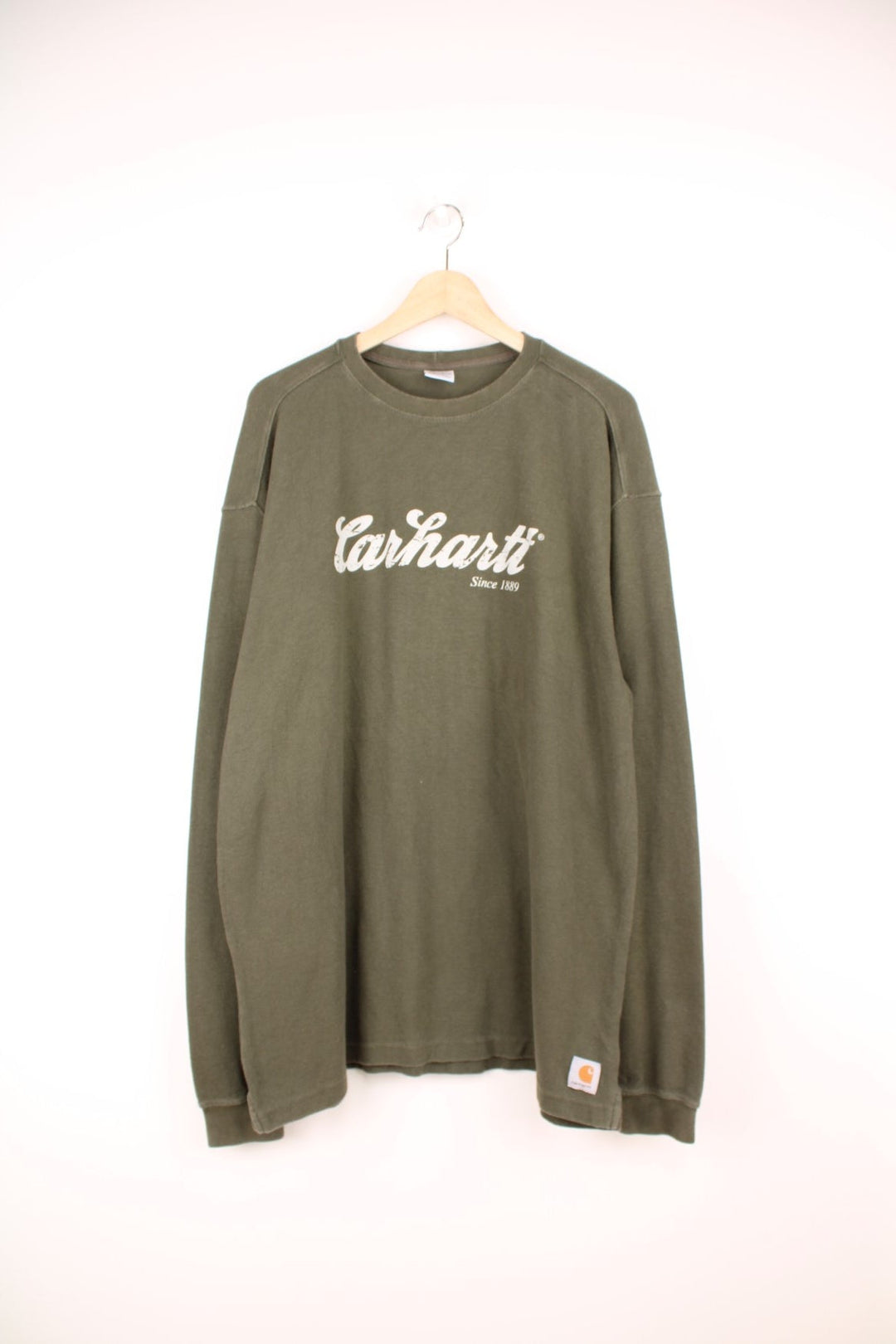 Carhartt long sleeved green waffle top with printed spell out logo across the chest.  