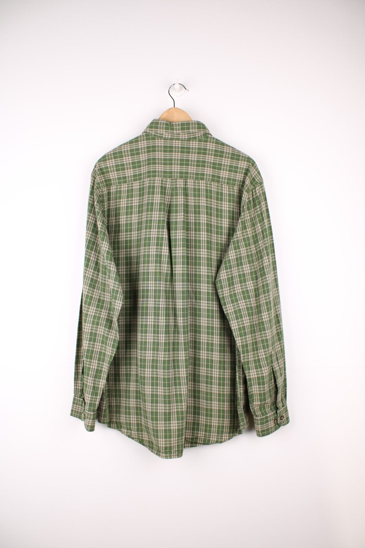 Carhartt green tone plaid button up cotton shirt with double chest pockets. Features signature embroidered logo on the pocket