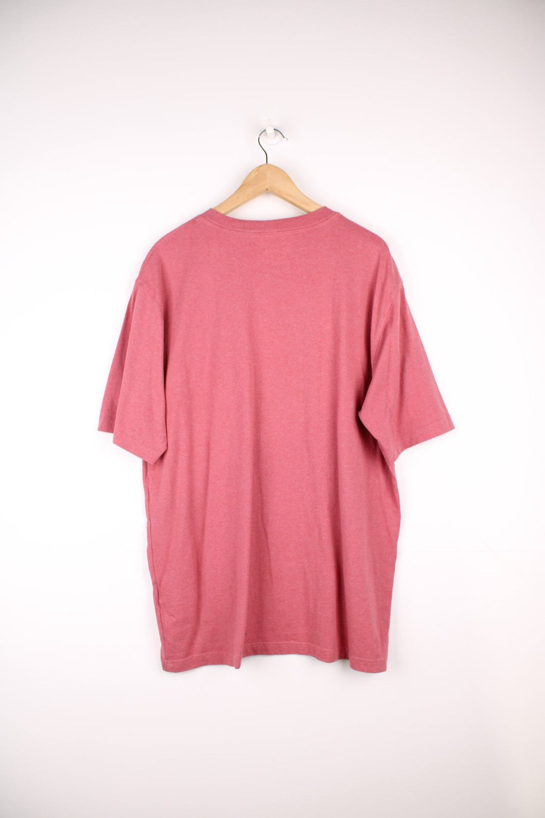 Carhartt pink 'loose fit' t-shirt with chest pocket. Features signature logo on the pocket