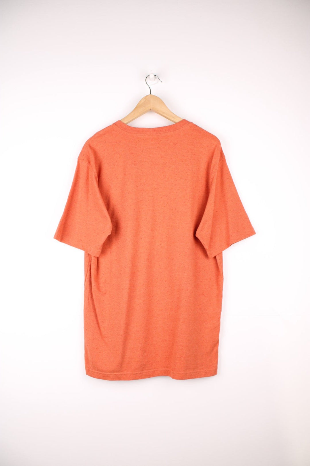 Carhartt orange 'loose fit' t-shirt with chest pocket. Features signature logo on the pocket