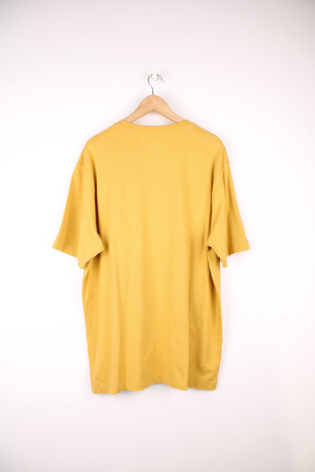 Carhartt yellow 'loose fit' t-shirt with chest pocket. Features signature logo on the pocket