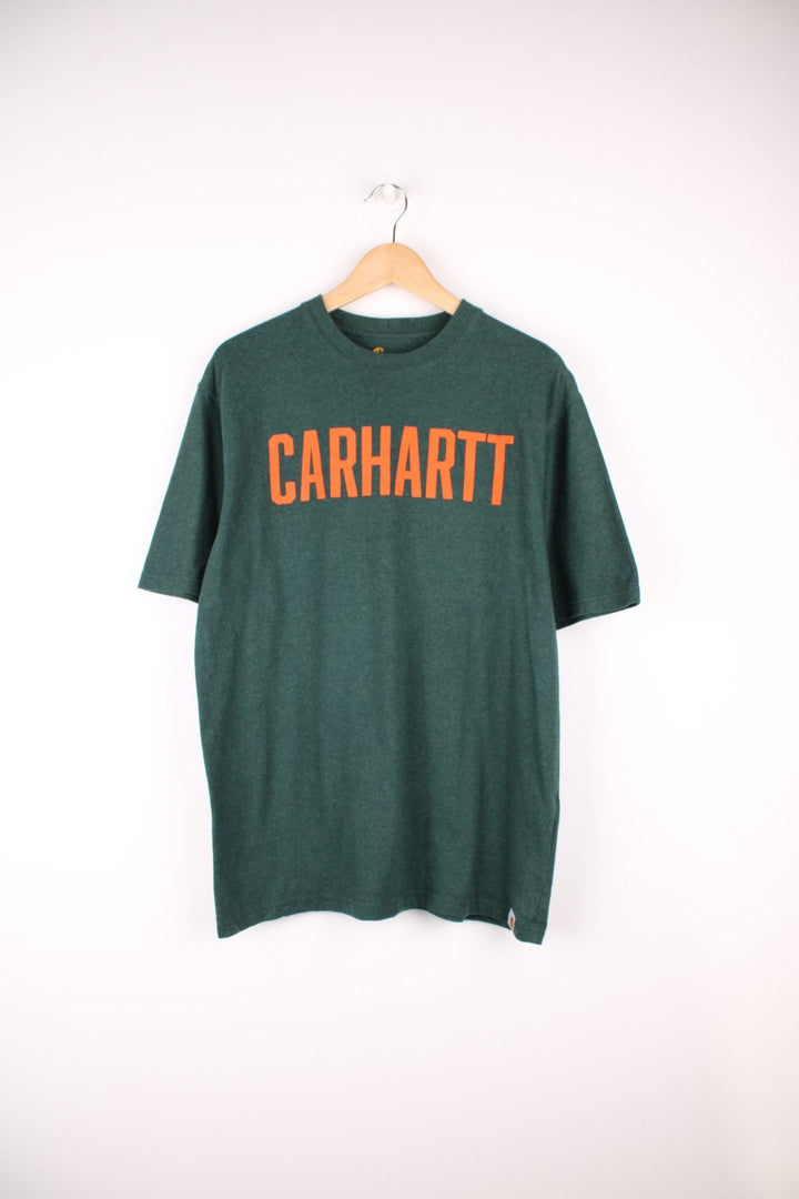 Carhartt green original fit t-shirt with orange spell-out graphic on the front