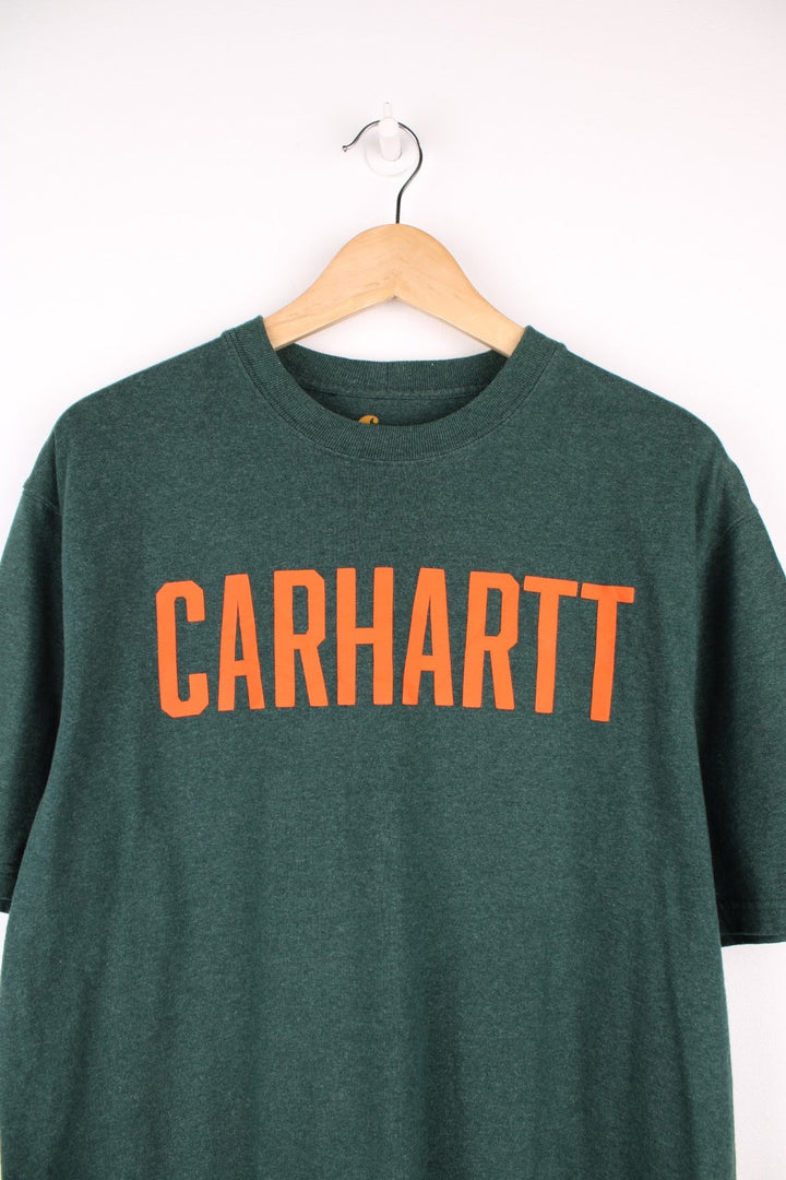 Carhartt green original fit t-shirt with orange spell-out graphic on the front