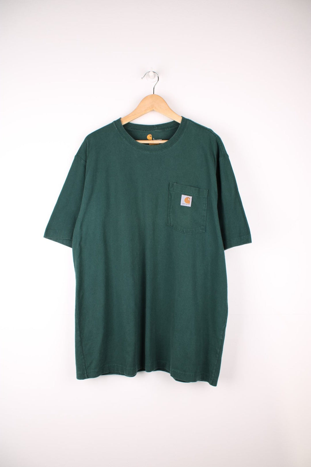 Carhartt green 'loose fit' t-shirt with chest pocket. Features signature logo on the pocket