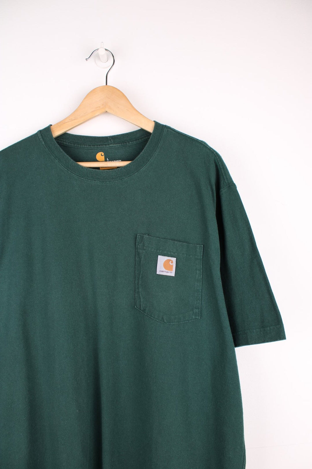 Carhartt green 'loose fit' t-shirt with chest pocket. Features signature logo on the pocket