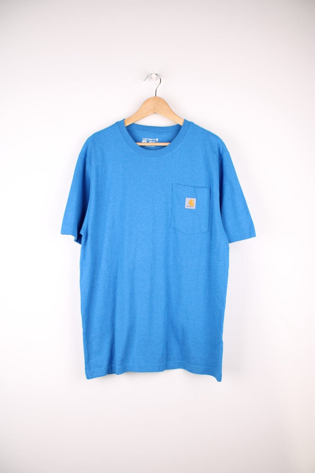 Carhartt blue 'loose fit' t-shirt with chest pocket. Features signature logo on the pocket