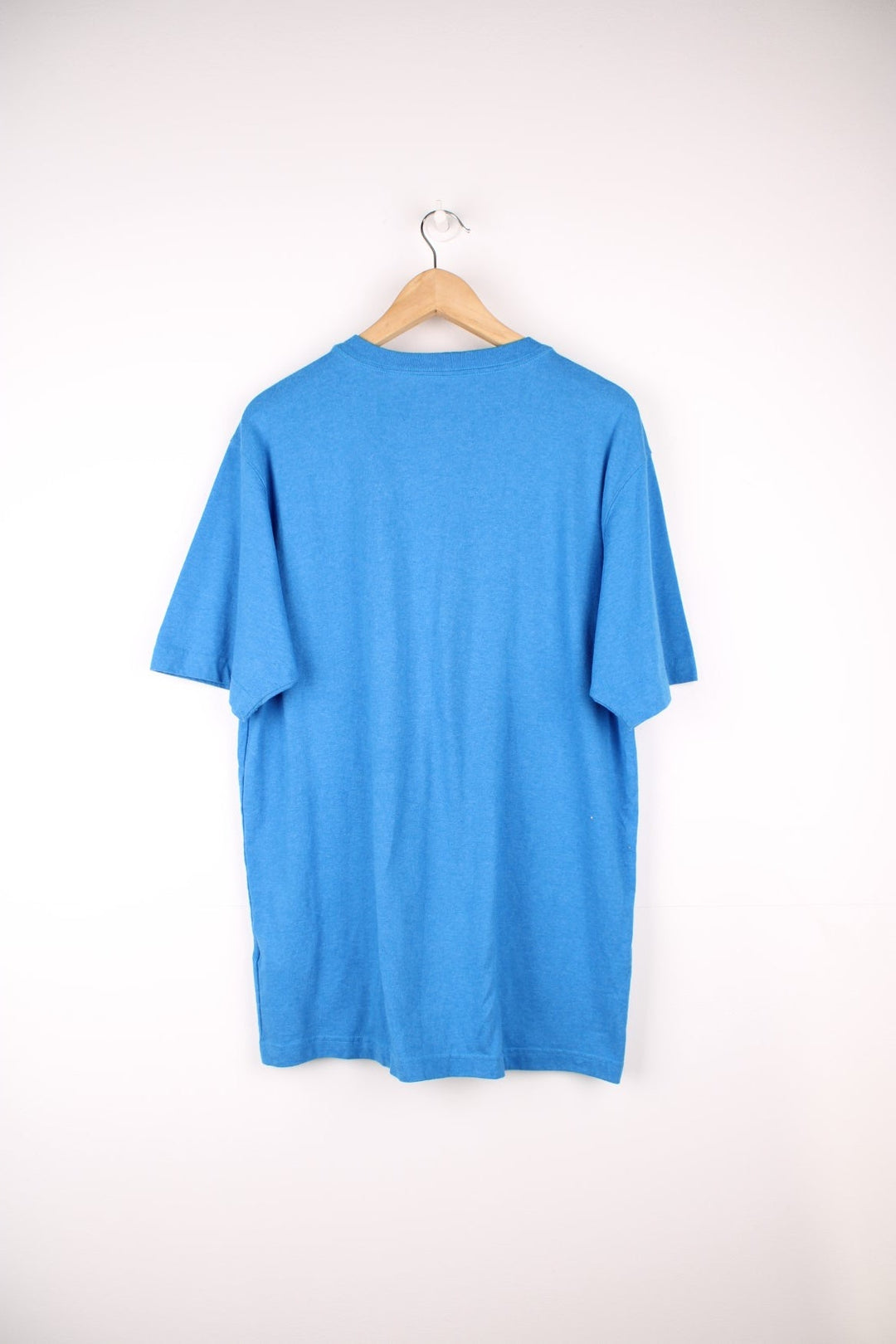 Carhartt blue 'loose fit' t-shirt with chest pocket. Features signature logo on the pocket