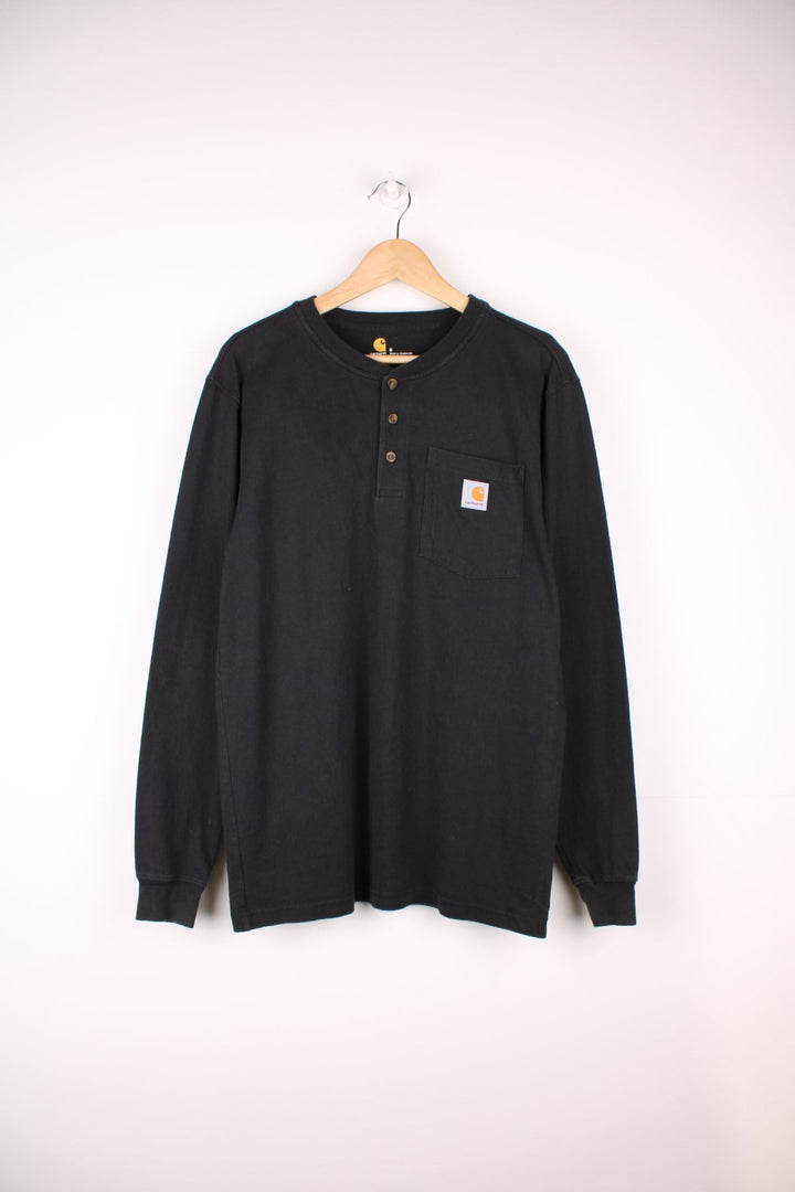 Carhartt 'original fit' black long sleeve top.Features signature logo on the chest pocket,three button fastening 