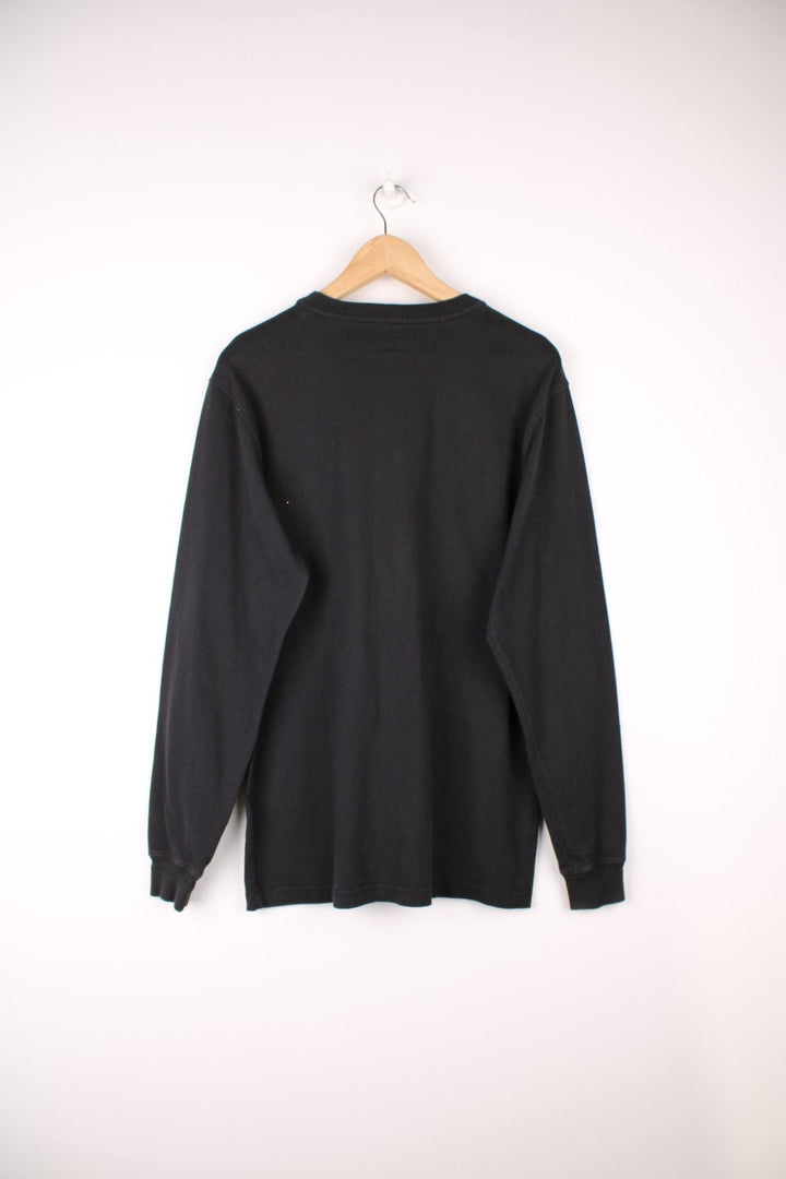 Carhartt 'original fit' black long sleeve top.Features signature logo on the chest pocket,three button fastening 