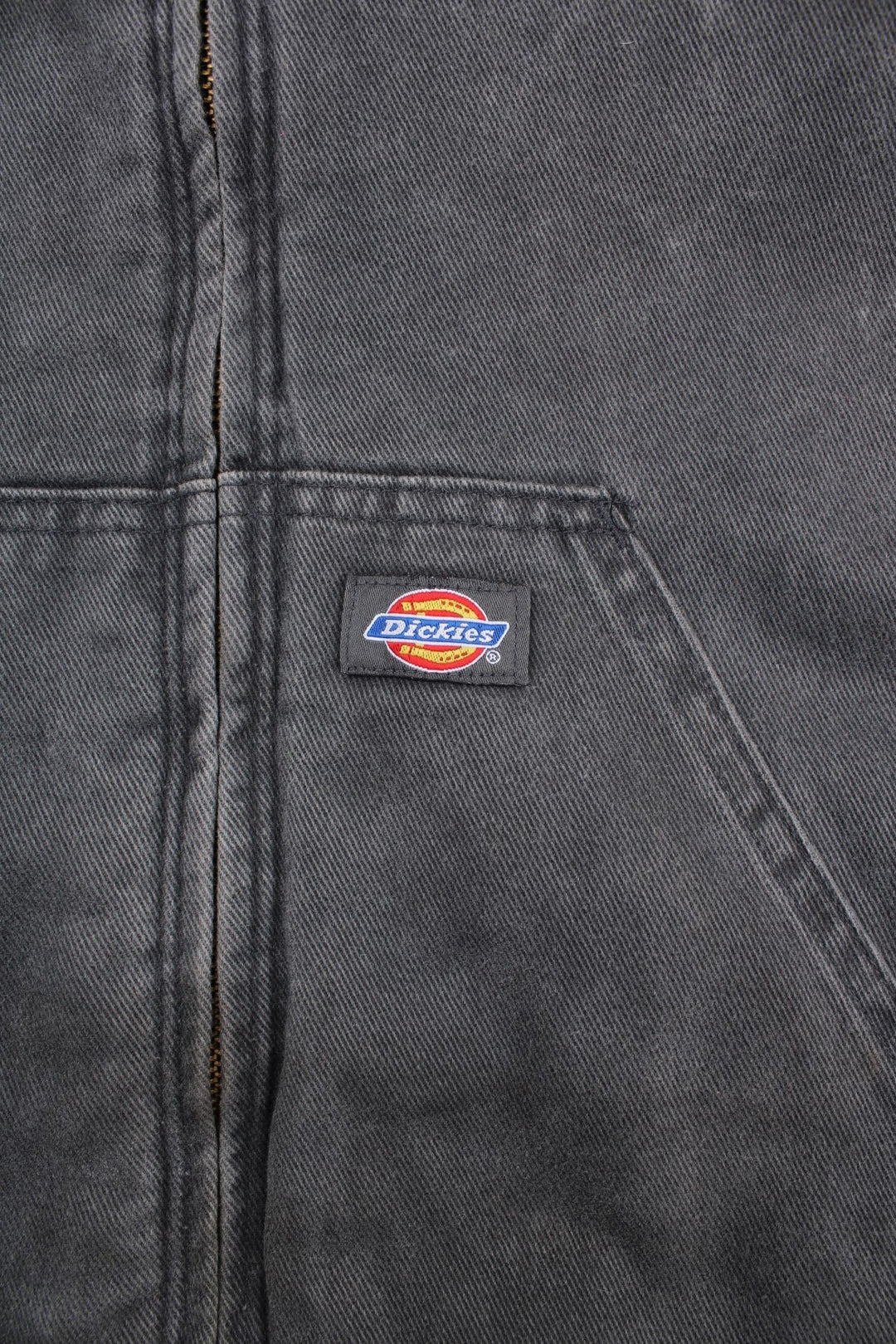 Dickies hooded work jacket in grey - quilt lined, with ribbed hem and cuffs, two pockets, zip closure, drawstring hood adjusters, and a small logo patch on the front.