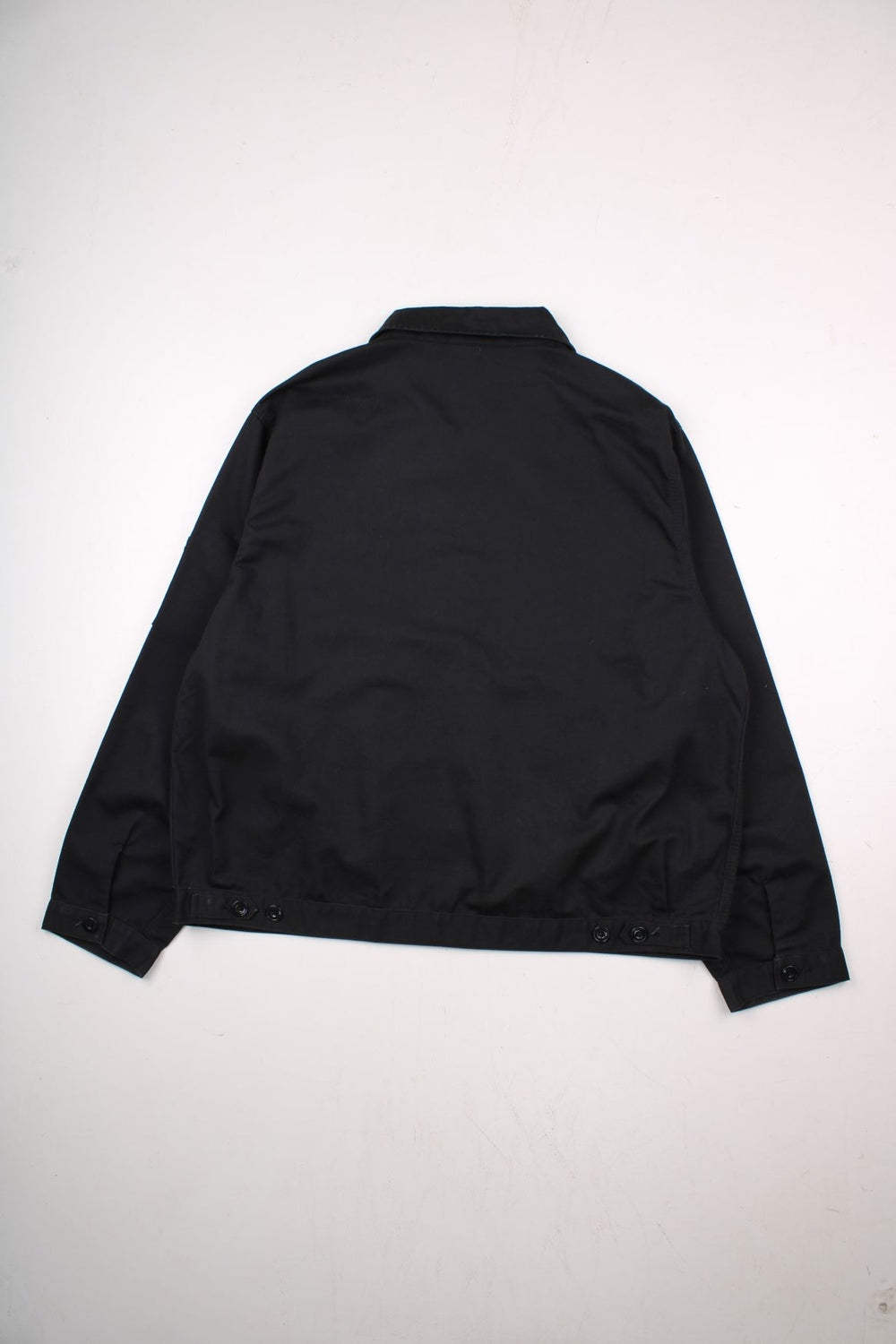 Dickies unlined Eisenhower jacket in black zip closure, multiple pockets, and a small logo patch on the front.