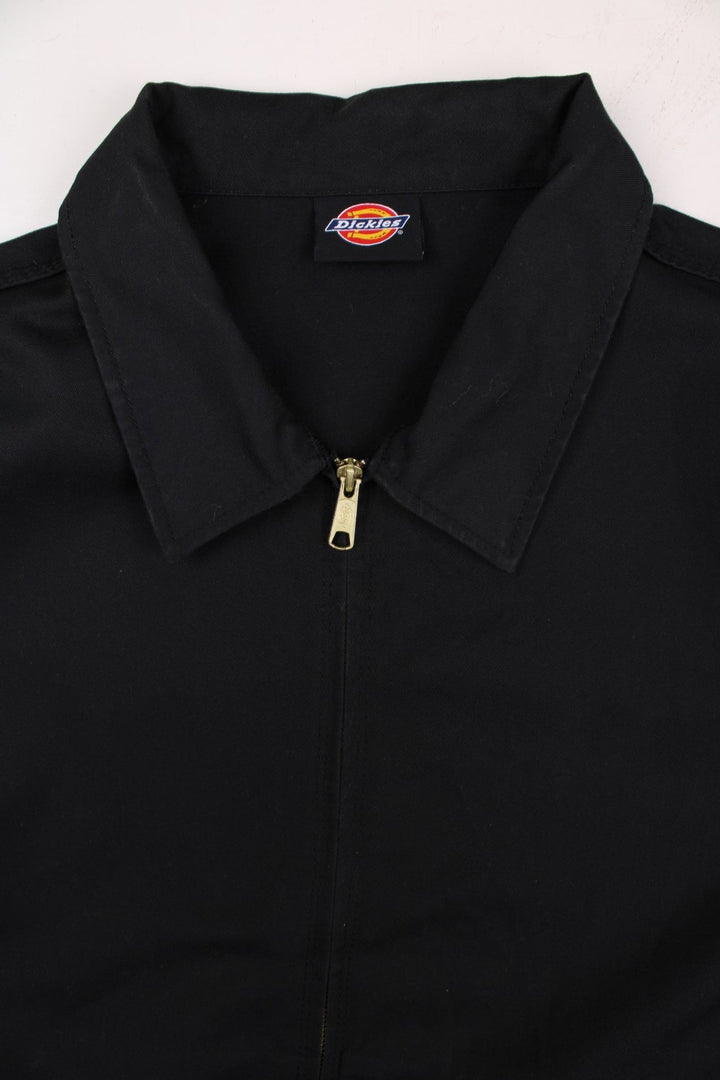 Dickies unlined Eisenhower jacket in black zip closure, multiple pockets, and a small logo patch on the front.