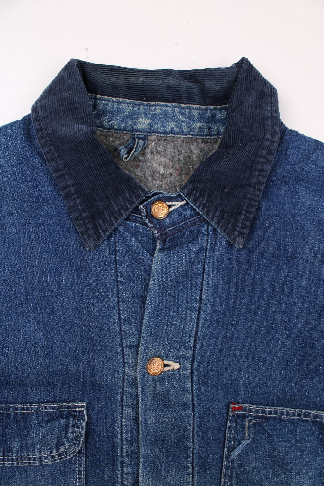 70s Wrangler denim chore jacket in blue - blanket-lined, with four patch pockets, button closure, and a corduroy collar.