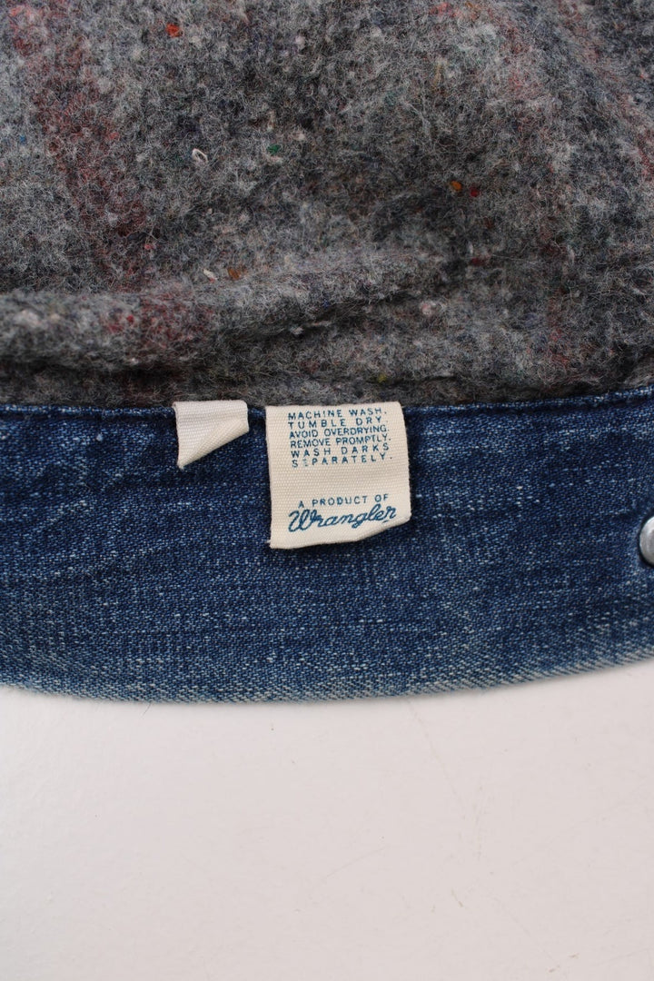 70s Wrangler denim chore jacket in blue - blanket-lined, with four patch pockets, button closure, and a corduroy collar.