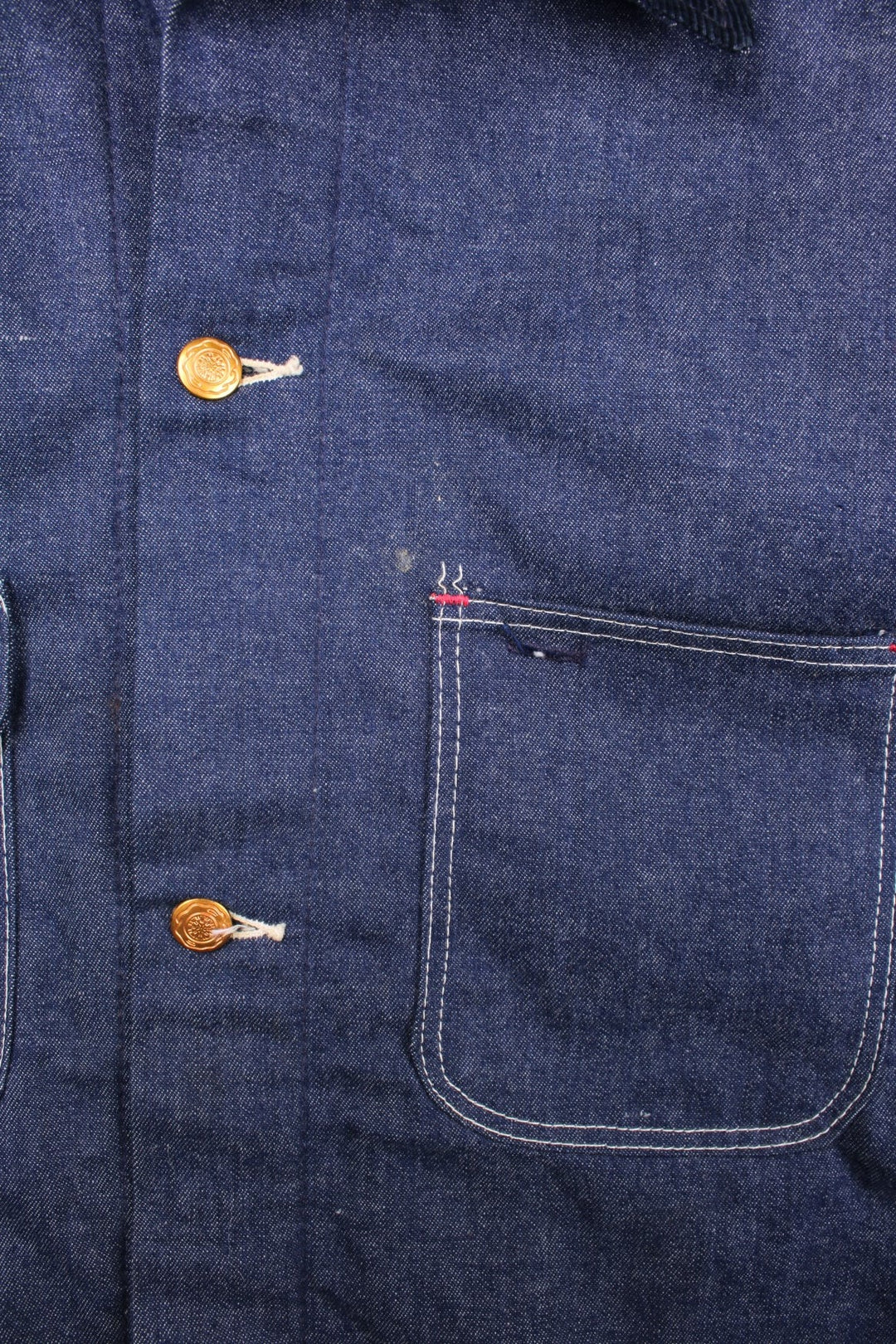 Vintage Blue Bell blanket lined denim chore jacket in indigo blue with four patch pockets, contrast stitching, and a corduroy collar.