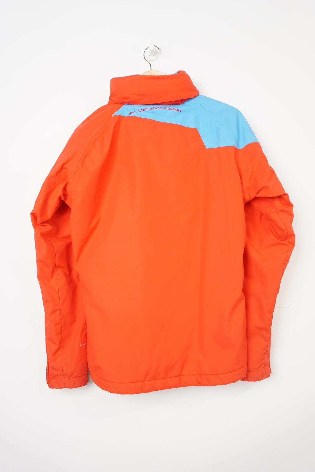 Nike ACG red and blue outdoor coat with foldaway hood and adjustable zip up sides