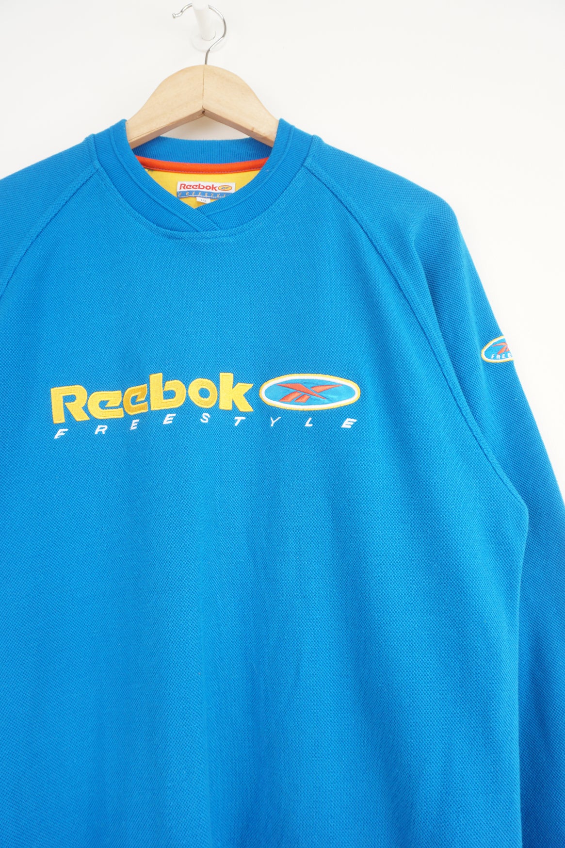 Reebok Freestyle bright blue sweatshirt with embroidered spell-out logo on chest