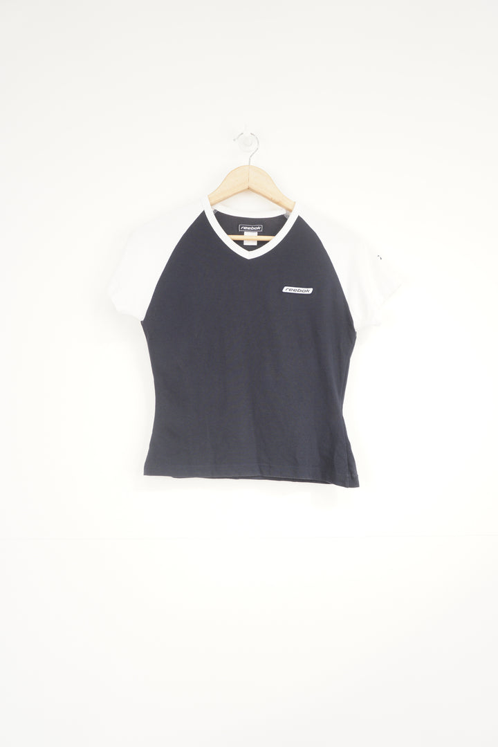 navy blue and white Reebok baby tee style t-shirt with embroidered logo on the chest