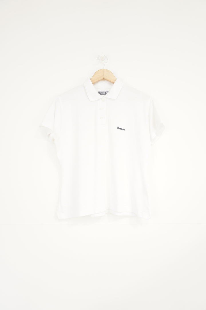 All white Reebok polo shirt with embroidered logo on the chest