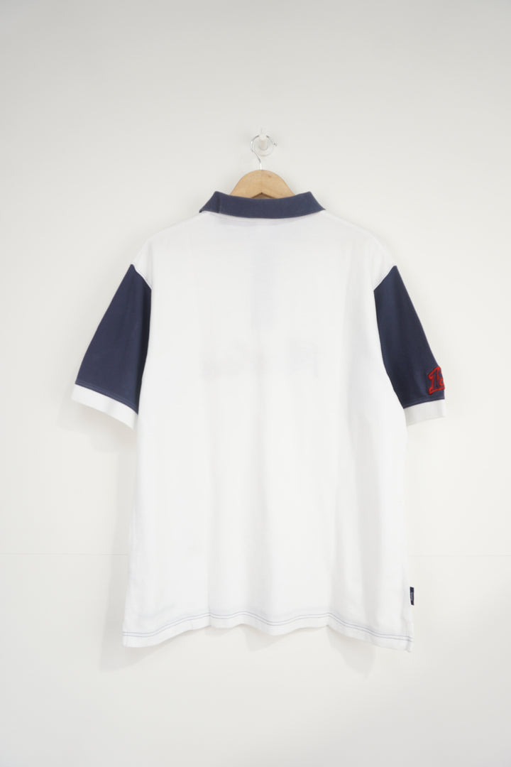 Reebok white and navy polo shirt with embroidered logo across the chest