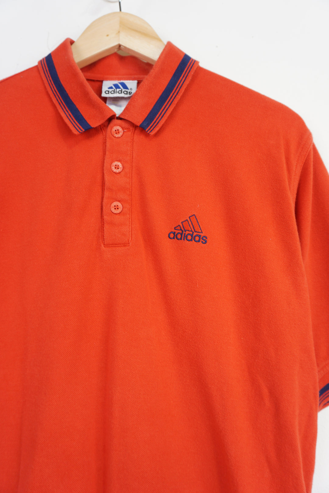 Vintage red Adidas polo shirt with embroidered logo on the chest