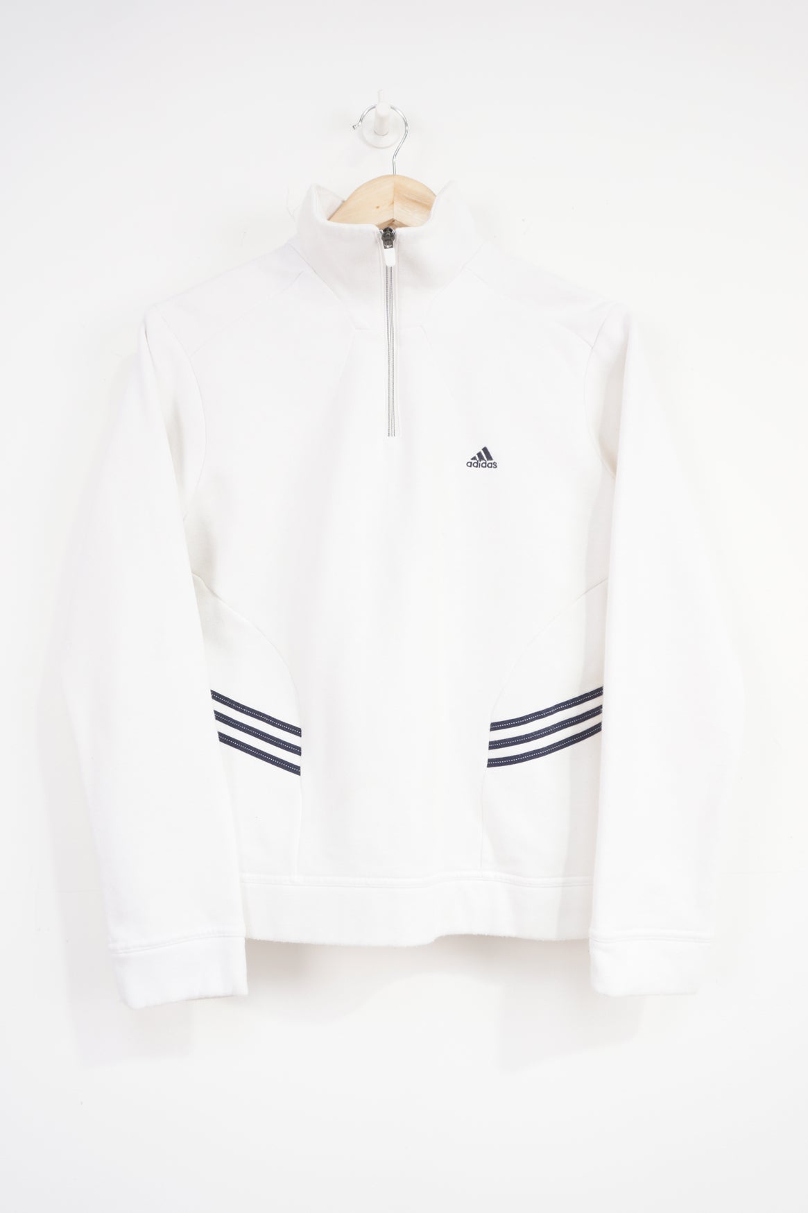 Adidas white 1/4 zip sweatshirt with navy blue embroidered logo on the chest and three stripes on the side 