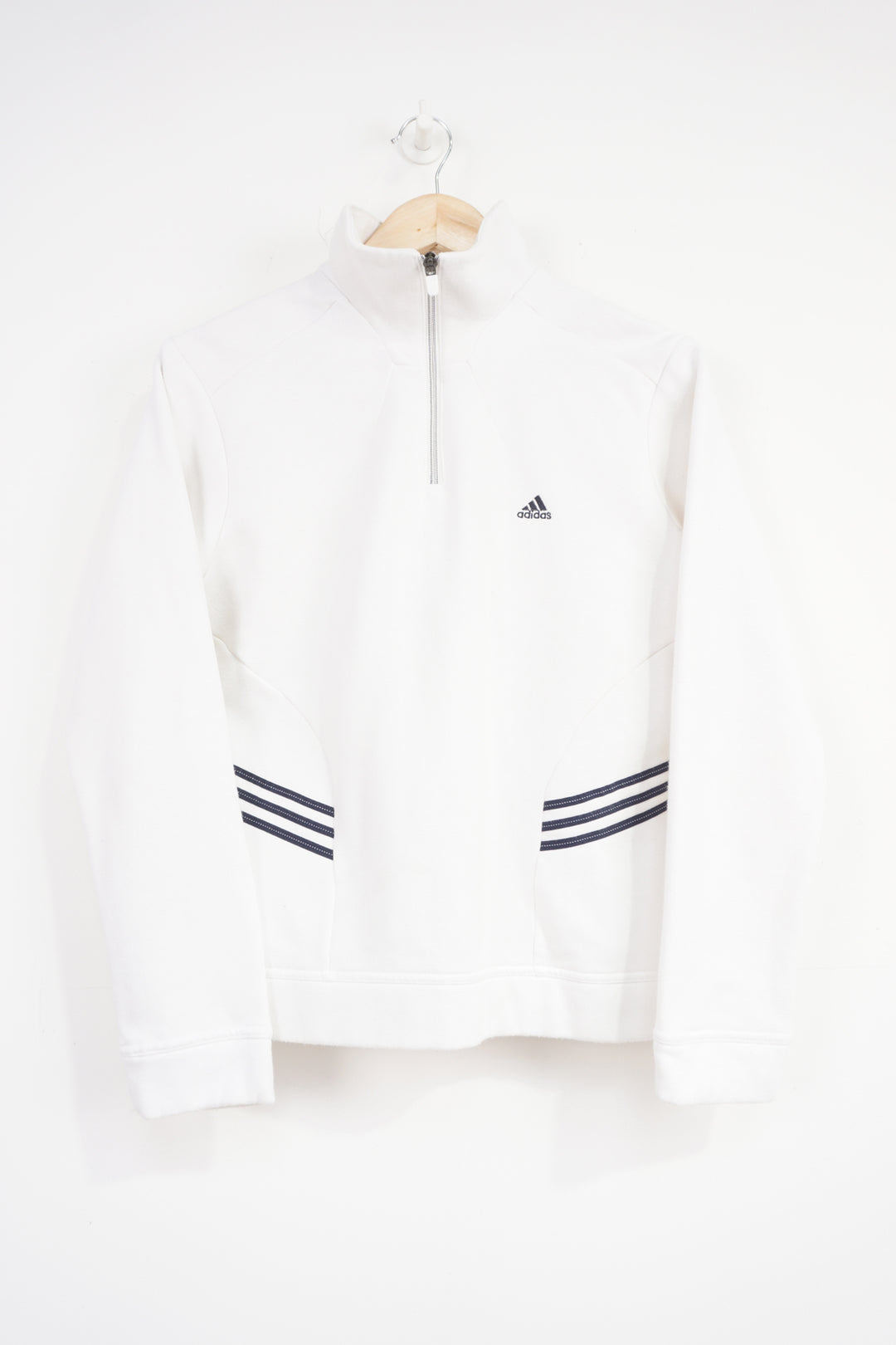 Adidas white 1/4 zip sweatshirt with navy blue embroidered logo on the chest and three stripes on the side 