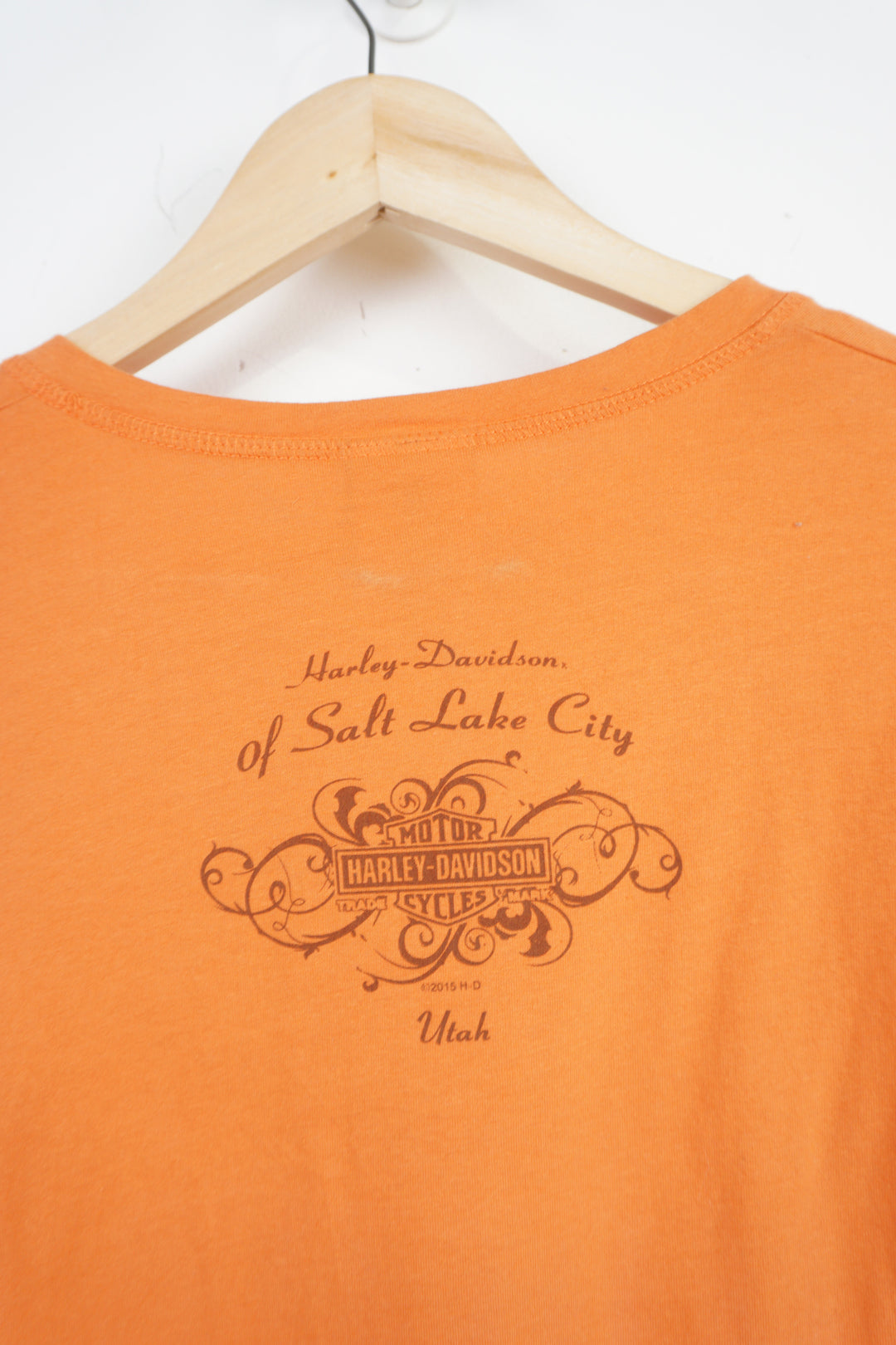 2015 Harley Davidson orange v neck t-shirt with spell-out and graphic on the front and back