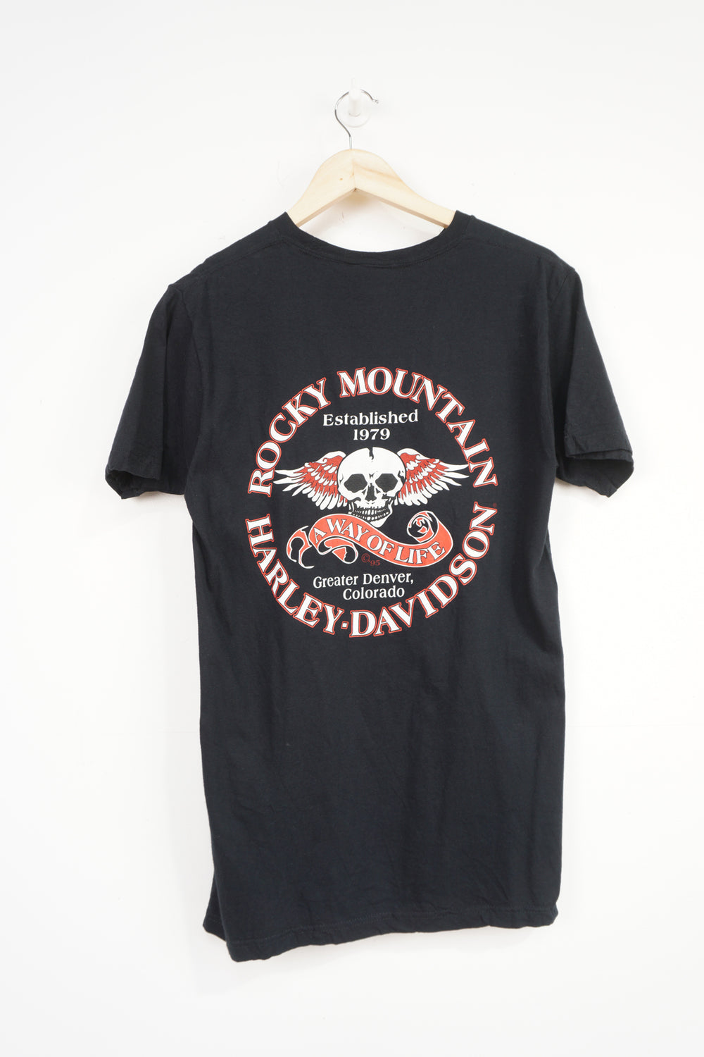 Vintage Harley Davidson black t-shirt with spell-out skull graphic on the front and Rocky Mountain spell-out details on the back 